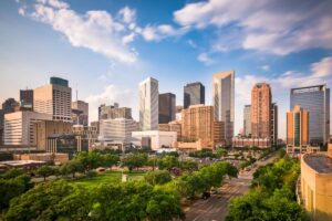 picture of downtown Houston under sunny blue skies as a symbol for finding equine assisted therapy near Houston, TX, for addiciton treatment.