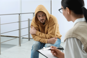 Two people talking about addiction support
