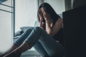 woman struggles with effects of distress