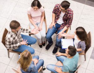 people meet in family support group
