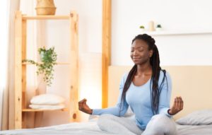 woman practices guided meditation
