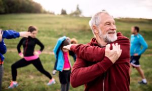 man participates in exercise with others