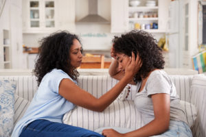woman discusses co-occurring disorders with mom