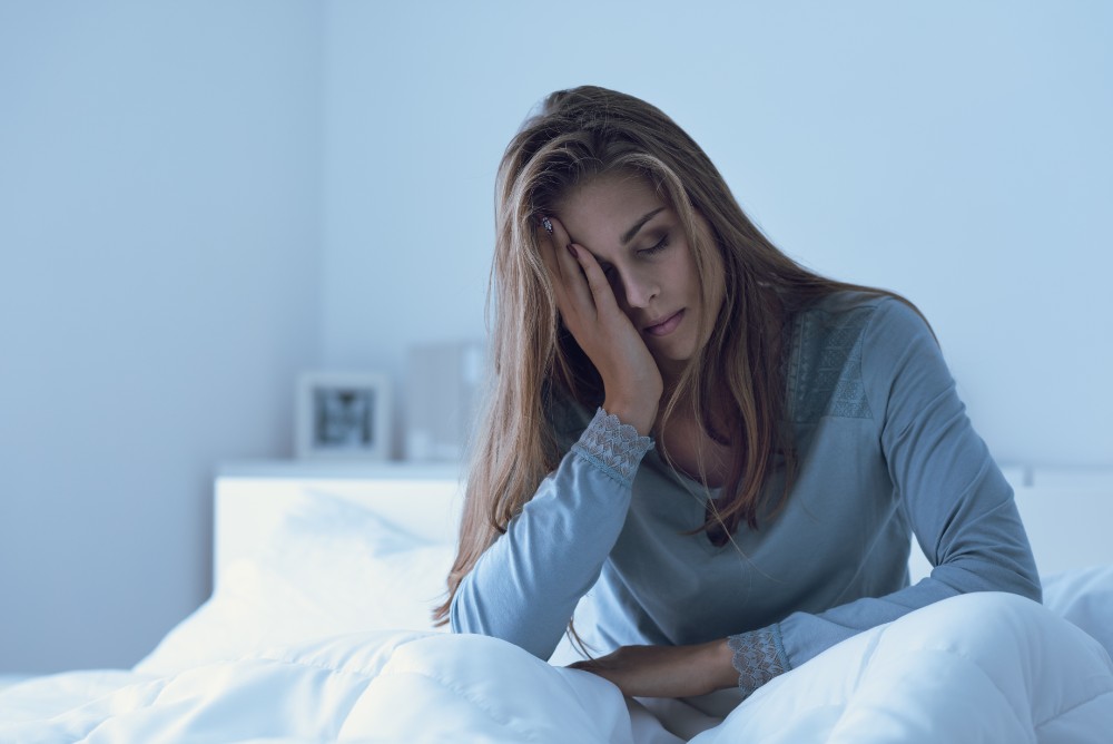 woman struggles with poor sleep