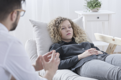 woman discusses ocd with counselor