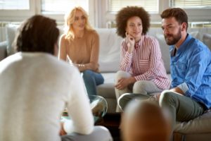 man meets with therapy group about self-forgiveness