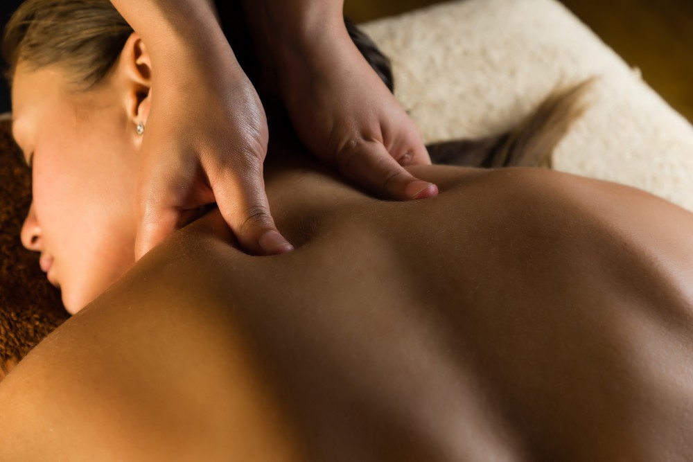 woman relaxes during massage therapy