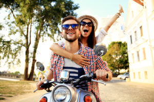 couple rides on motorcycle