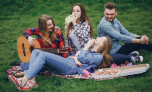teens relax in park