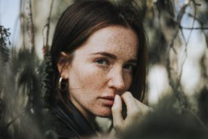 woman struggles with emotional signs of addiction