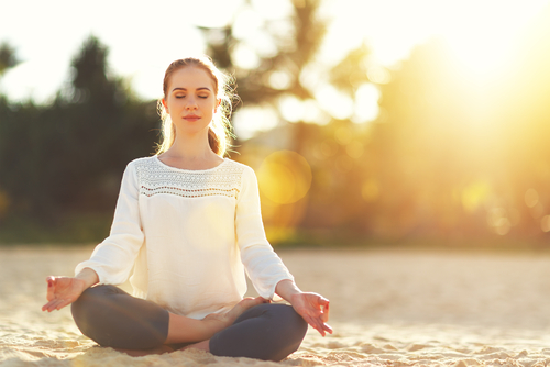 woman practices meditation as a coping skill