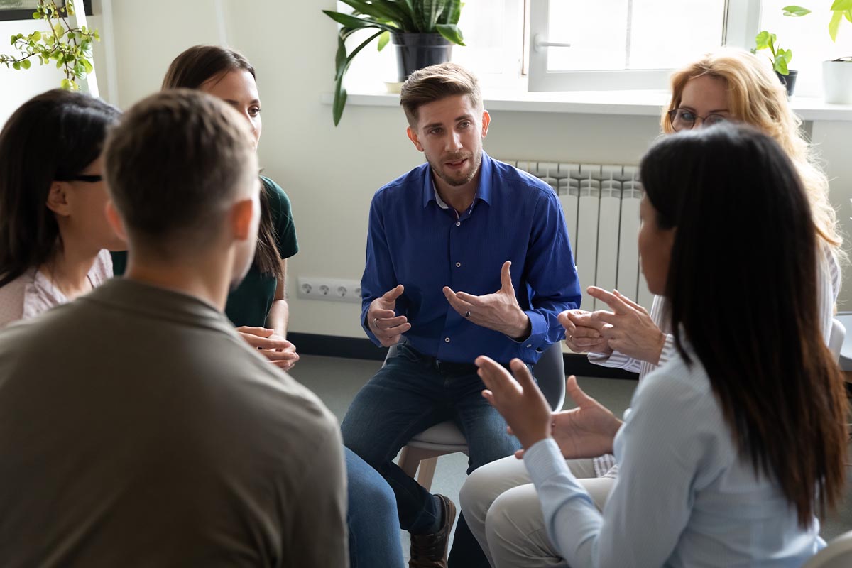 group talking about choosing an intensive outpatient program