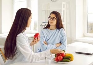 a person receives nutrition counseling from a counselor