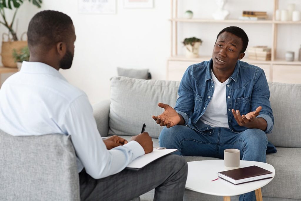 a person talks to a therapist in extended care treatment