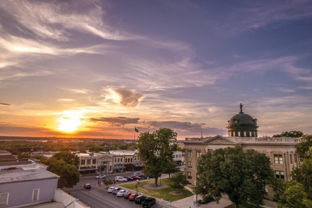 cityscape at sunset showcasing the ideal setting for equine therapy for addiciton recovery in Georgetown, TX.