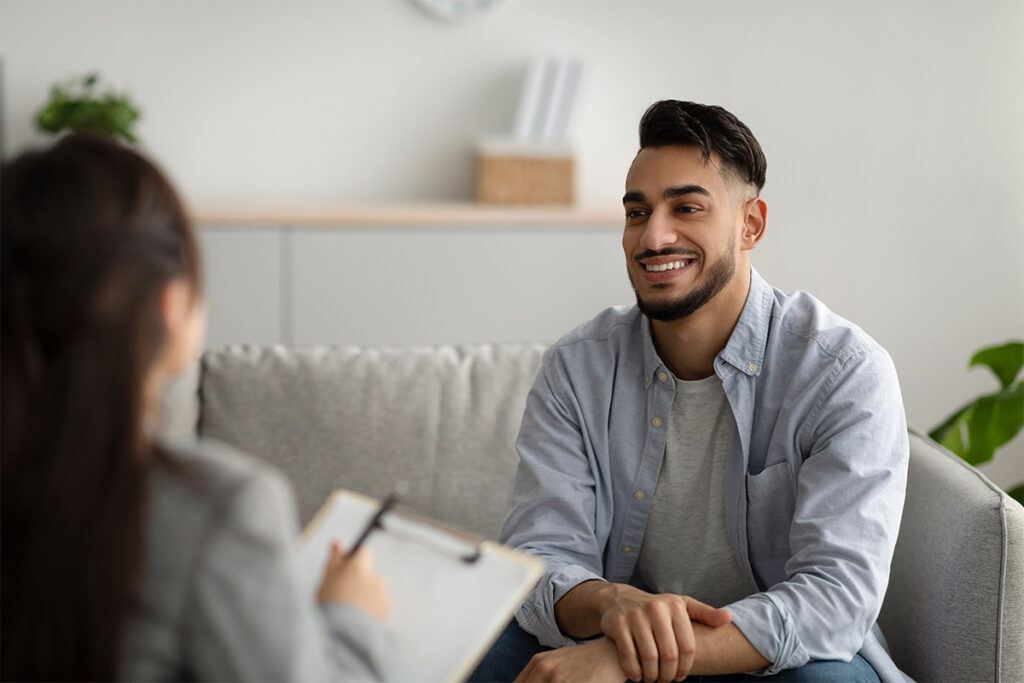 young man speaking to behavioral health specialist about ketmine addiction recovery and finding hope, support, and lasting change.